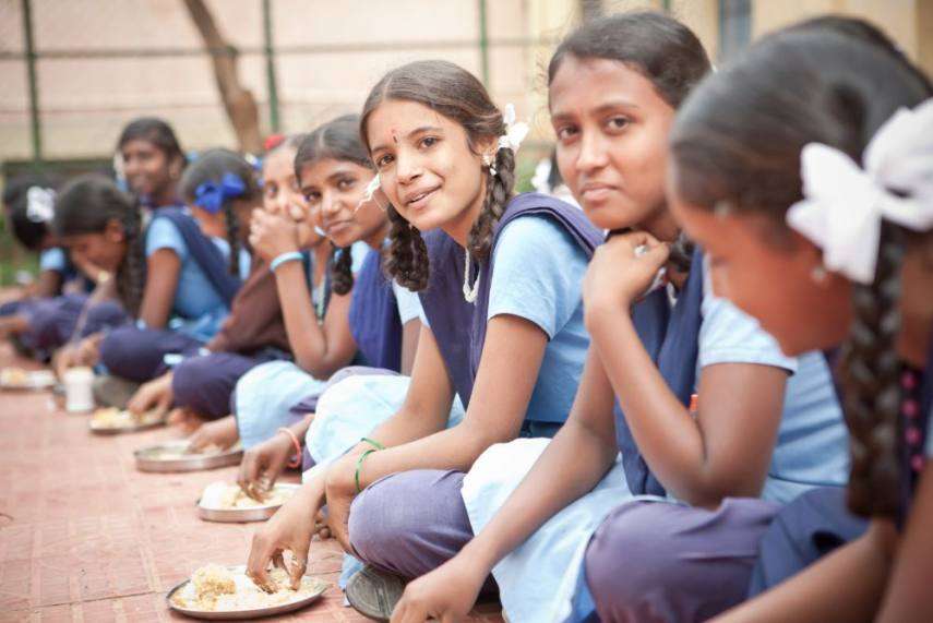 School girls having mid day meal